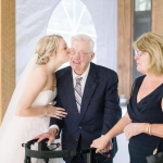 bride kisses her grandfather